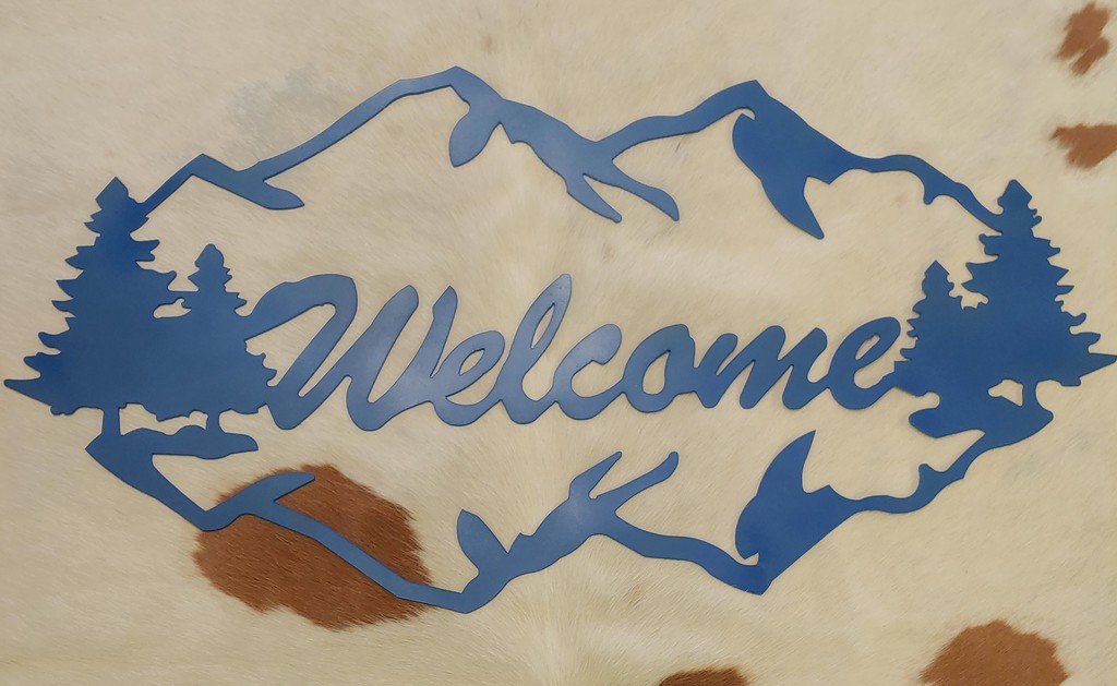 36 in x 16 in Mountain Welcome sign in blue sign. Custom made by the KHS Metal Fabrication class